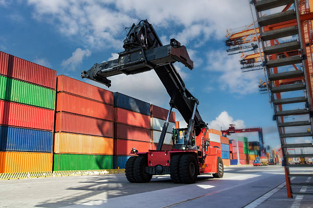 istock Mobile Crane ready for moving the freight container to the yard. 2231641416