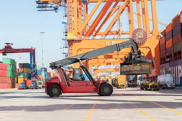 istock Mobile Crane ready for moving the freight container to the yard. 2231645342