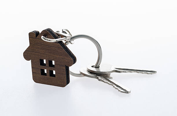 istock House shaped with a key on white background 2231648642
