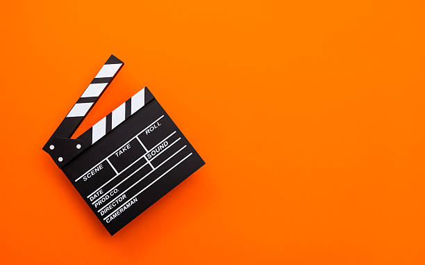 Film slate on orange background