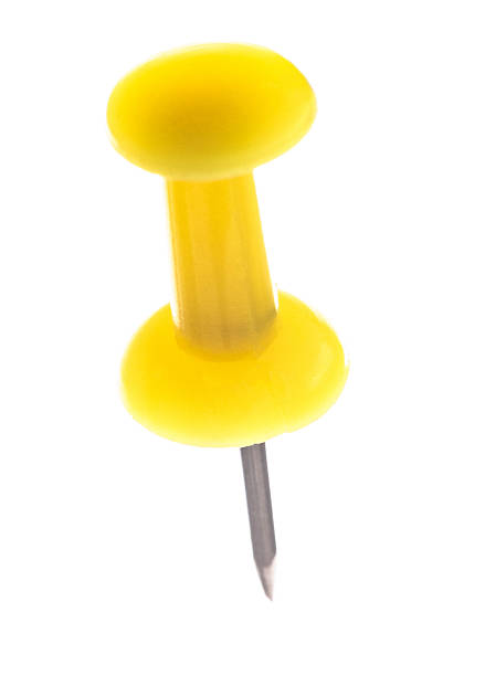 istock Single yellow pushpin isolated on white background 2231649847