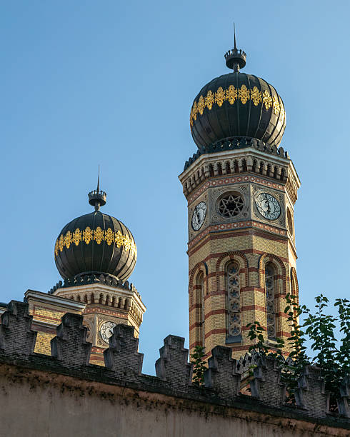 Low angle side view close up of the Great Synagogue (Dohany Street Synagogue) twin towers in Budapest Hungary.