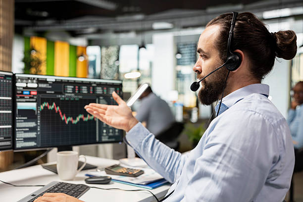 istock Professional consultant in office talking with clients, explaining stock market trends 2231652816