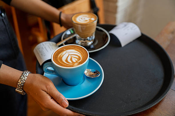 Barista Serving Coffee with Latte Art on Tray