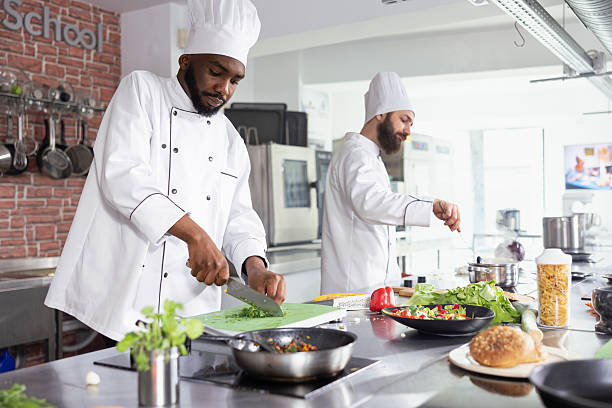 istock African american chef chopping herbs and spices on a cutting board 2231654008
