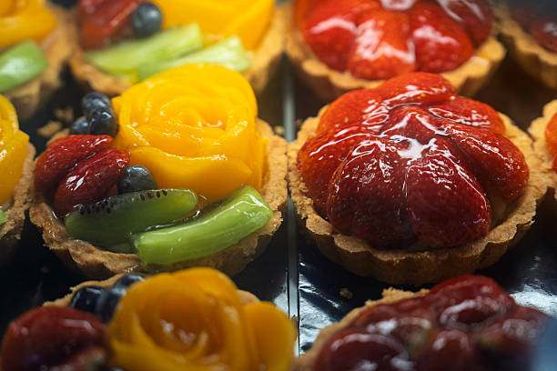 Colorful Fresh Fruit Tarts in Bakery Display