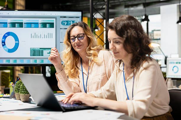 istock Empowered group of women strategizing together with data reports 2231656203