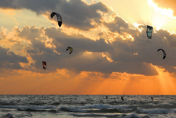 Tel Aviv, Israel - October 28, 2011: Kitesurfing on the Mediterranean beaches of Tel Aviv at orange sunset