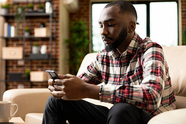 istock Remote manager checking and replying to emails on phone 2231658203