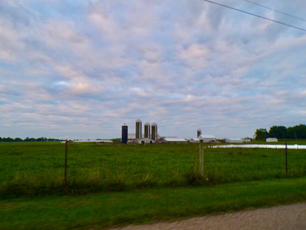 istock Farm with silos and white clouds. 2231660290