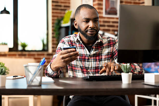 istock Self employed black man updating banking details 2231666655