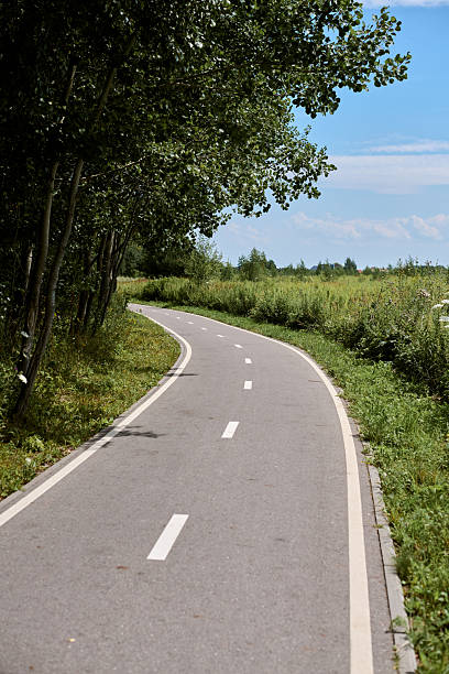istock Serene countryside cycleway curving through verdant landscape 2231666785
