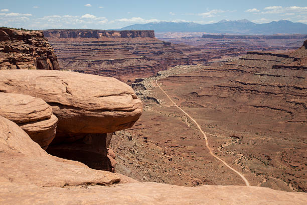 istock Elevated view of sandstone mountains and valley with road 2231667089