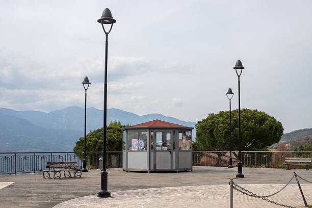 Valva, Italy -12 April 2025: Scenic Square with Panoramic View and Street Kiosk on a Sunny Day.