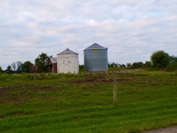 istock Silos in pasture with cloudy skies. 2231668711