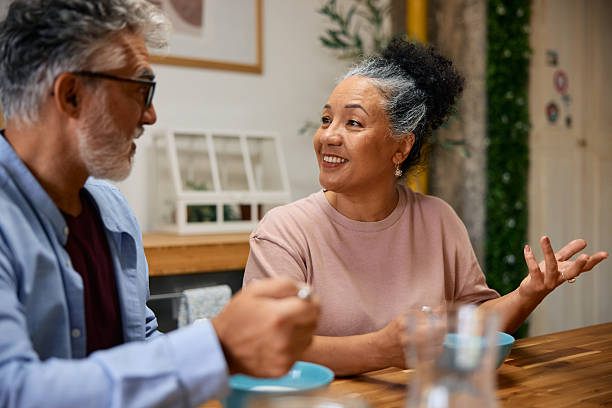 istock Senior couple enjoying breakfast and talking at home 2231673444