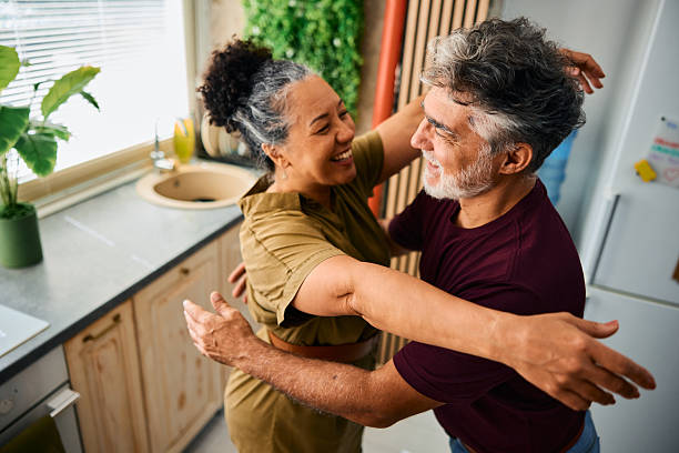 istock Happy mature couple embracing in the kitchen 2231674584