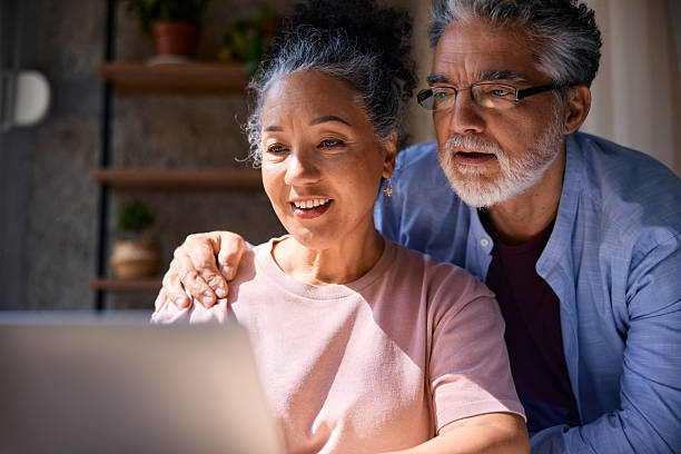istock Senior couple using laptop at home 2231674852