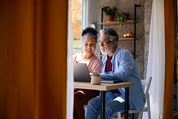 istock Senior couple using laptop at home 2231674924