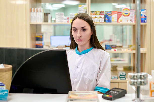 istock Focused pharmacist working at pharmacy counter 2231675890