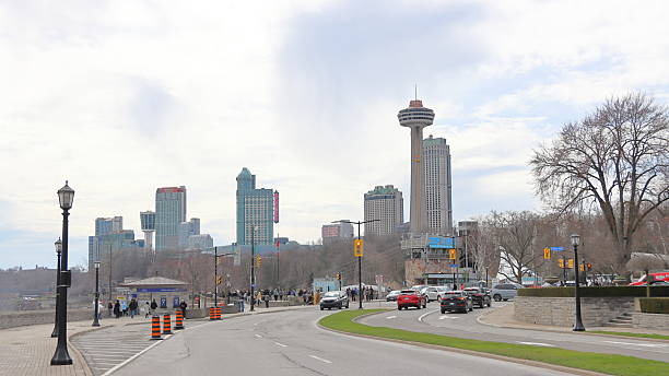 A clear view of Niagara Falls city in Ontario, Canada, featuring urban buildings, greenery, and bright natural light. Perfect for travel, tourism, and cityscape themes.
