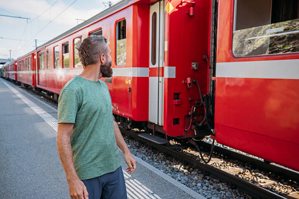 istock Bearded Man Waiting at Train Station Platform 2231676482
