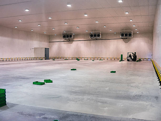 istock Inside a spacious cold storage warehouse with a forklift and cooling units. 2231681558