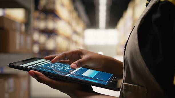 istock Close up of distribution hub worker overseeing supply chain process 2231682224