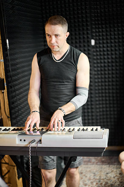 istock Focused keyboard practice in music rehearsal studio 2231684194