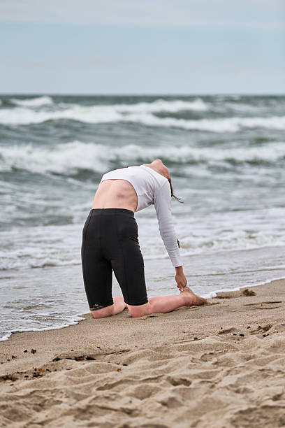 istock Yoga pose on baltic sea shoreline 2231684267