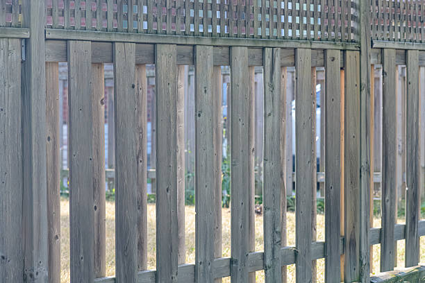 istock Weathered Wood Plank Fence 2231685825