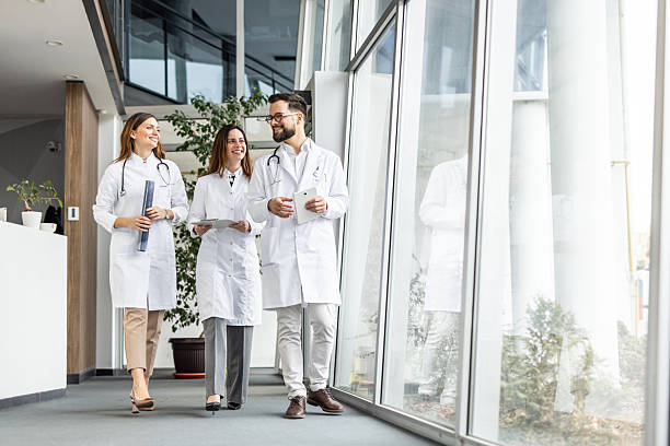 istock Doctors walking and talking in hospital corridor 2231688922