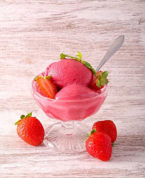 Strawberry sorbet scoops, served
