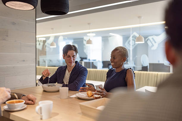istock Business Meeting over Breakfast in Modern Office Setting 2231689242