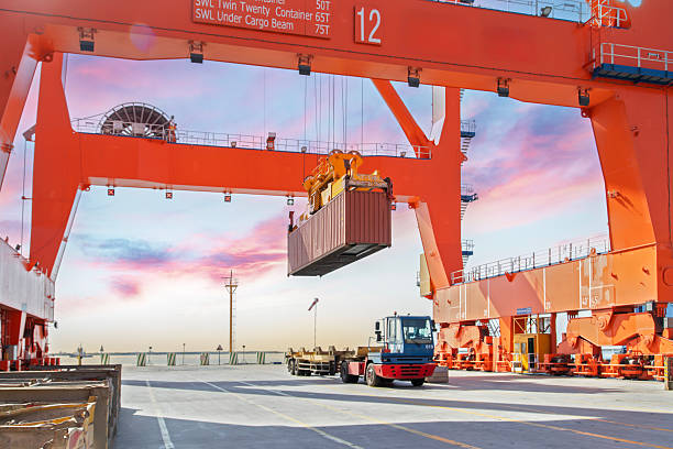 istock The loading truck is moving the freight container to the yard 2231690598