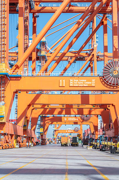 istock The loading trucks moving the freight container to the yard. 2231692938