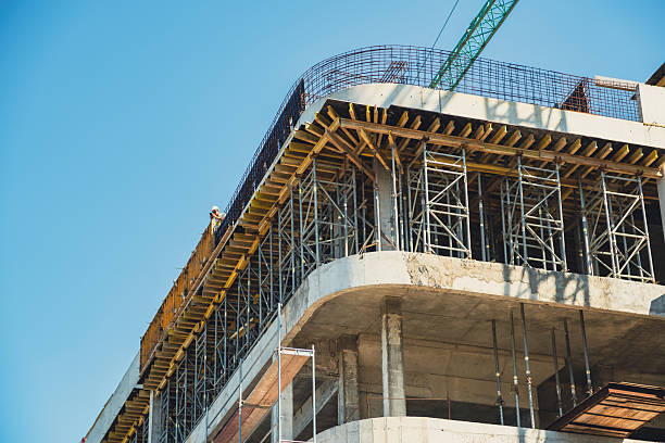 istock Construction site showcasing progress on a multi-story building under a clear blue sky 2231696024
