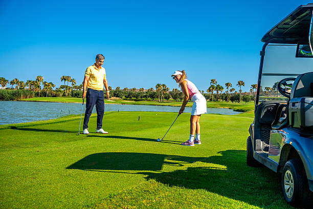 istock Golfers playing a round of golf on a sunny day 2231696358