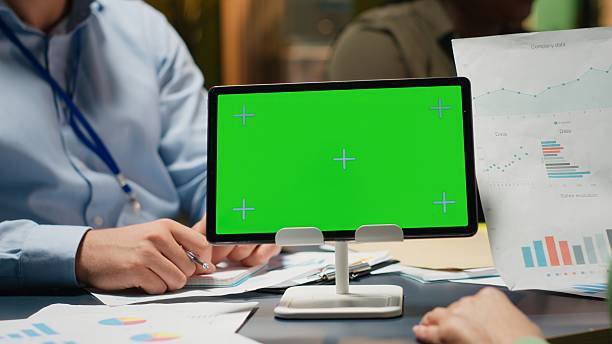 istock Diverse company workers hold phone with isolated chroma key 2231699583