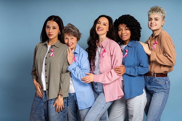 istock Women supporting breast cancer awareness campaign posing together 2231702764