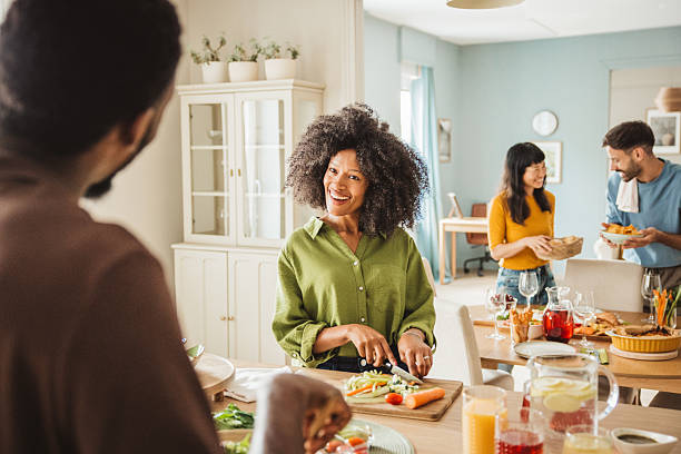istock Friends preparing a meal together 2231705267