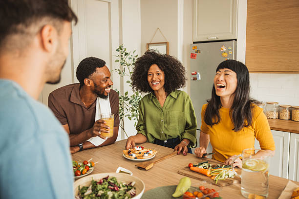 istock Friends preparing a meal together 2231705303