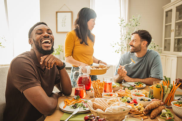 istock Friends preparing a meal together 2231705321