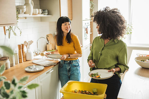 Friends doing dishes after  dinner party