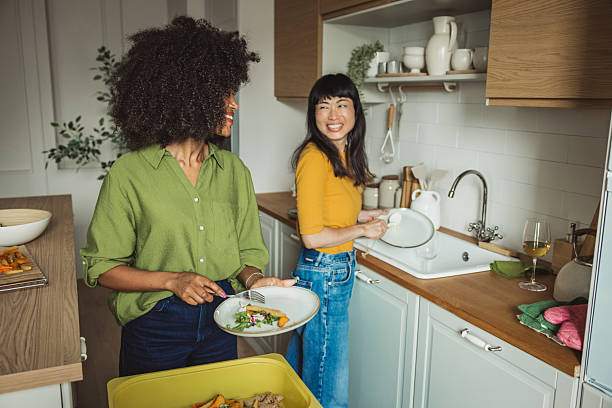 istock Friends doing dishes after  dinner party 2231705383