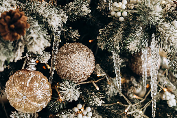 istock Decorative ornaments and snowy branches adorn a festive Christmas tree during winter celebrations 2231706573