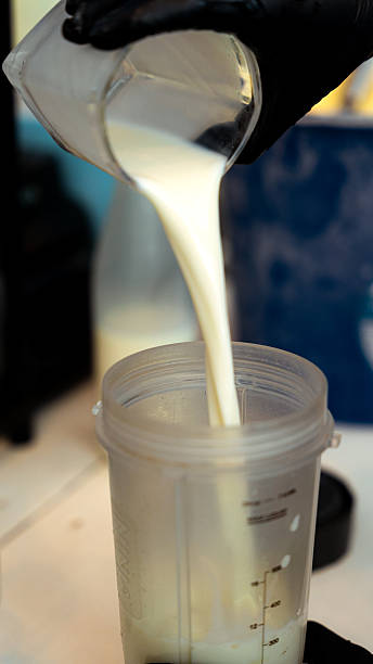 istock Chef pouring milk into blender for a creamy recipe 2231707940