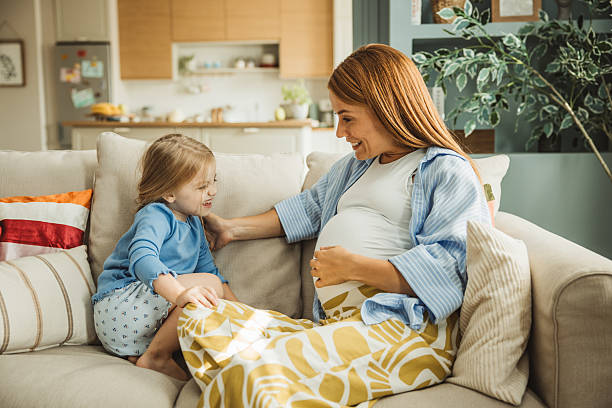 istock Pregnant mother and her daughter hugging 2231709175