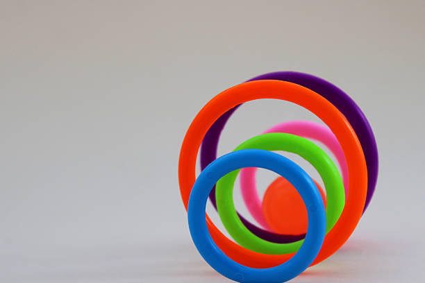 Ball passes through colorful plastic circles