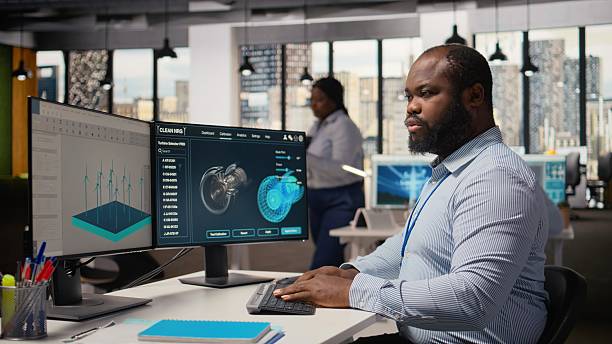 istock Renewable energy engineer in office upgrades windmill farm infrastructure 2231717976